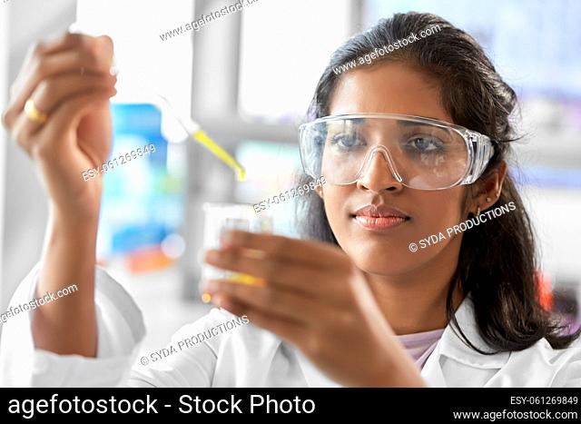 scientist with chemical working in laboratory