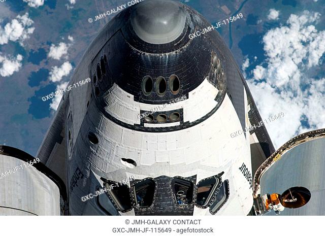 This view of the nose and partial crew cabin of the space shuttle Endeavour was provided by an Expedition 27 crew member during a survey of the approaching...