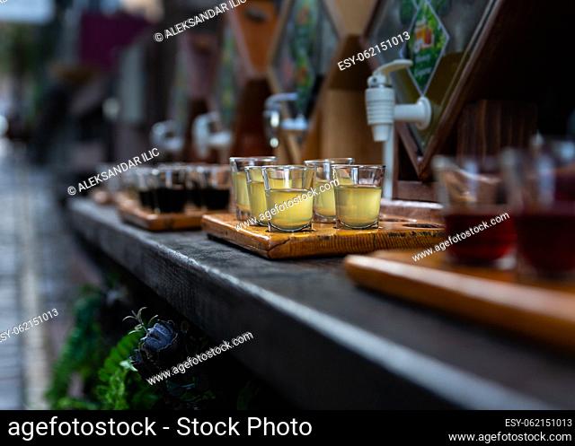 Assortment of hard strong alcoholic drinks and spirits in glasses on bar counter