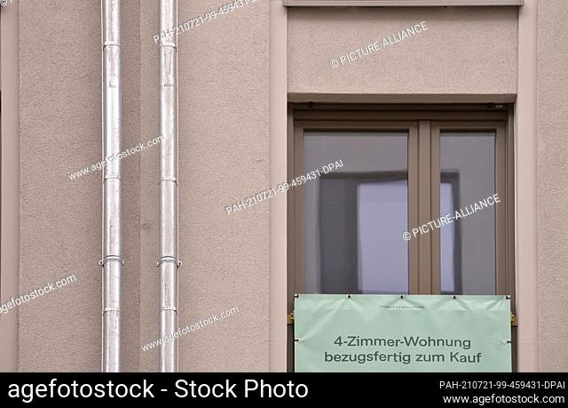 24 June 2021, Saxony, Leipzig: ""4-room apartment ready to move in for sale"". Various notices hang on a newly built, multi-storey residential building in a...