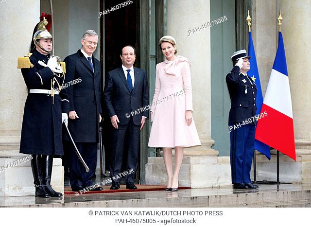 King Philippe (2nd L) and Queen Mathilde of Belgium (2nd R) visit President Francois Hollande of France (C) at the Elysee palace in Paris, France