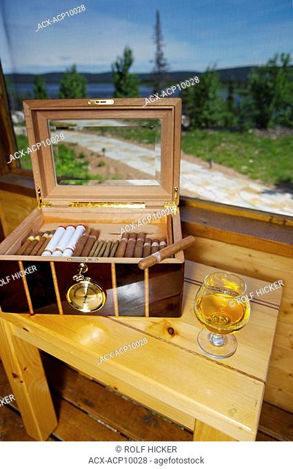 Cigar Box and glass of Brandy in the porch Rifflin'Hitch Lodge in Southern Labrador, Newfoundland & Labrador, Canada