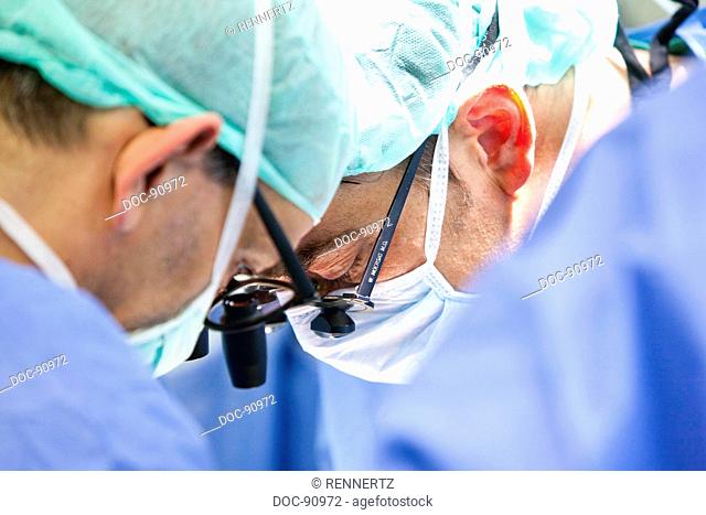 Doctors are operating on an open heart