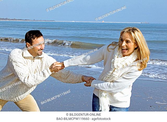 couple having fun by the sea