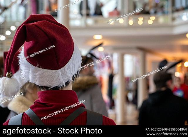 09 December 2023, Bavaria, Coburg: Whether with Christmas hats or bunny ears on their heads: numerous anime, manga and Japan fans in colorful costumes travelled...
