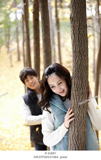 Young Couple In A Park In Autumn
