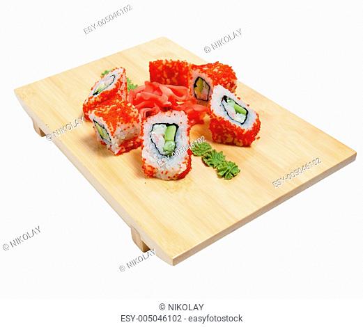 Sushi on wooden stand