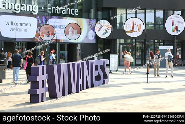 27 July 2022, Bavaria, Nuremberg: The hashtag ""#VIVANESS"" is displayed at the entrance to the fair Biofach - Vivaness in single capital letters