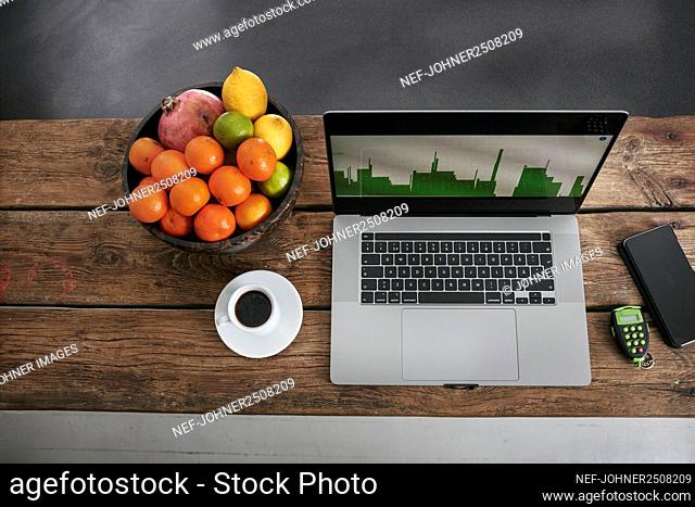Laptop and coffee cup on desk