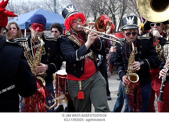Detroit, Michigan - The Detroit Party Marching Band plays as Detroit residents hold the Marche du Nain Rouge to celebrate the coming of spring and to banish the...