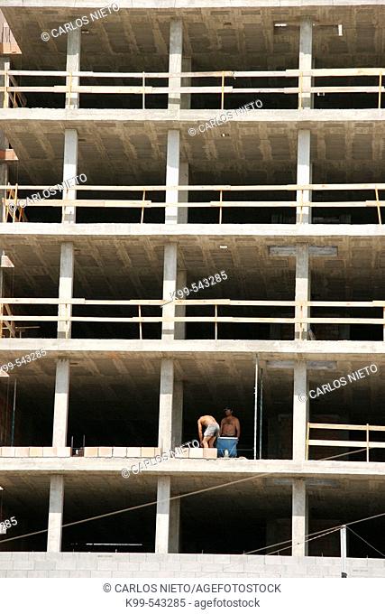 Workers in construction building