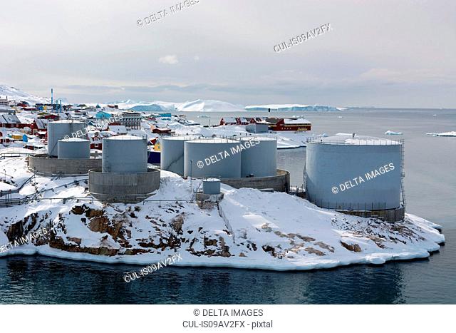 Elevated view of snow covered oil tanks at Ilulissat, Greenland