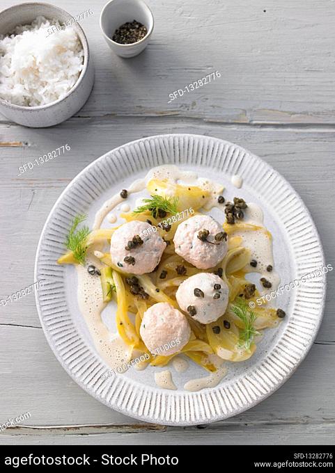 Salmon trout dumplings with lime butter and capers