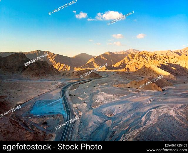 Jebel Jais mountain desert road surrounded by sandstones in Ras al Khaimah emirate of the United Arab Emirates aerial view