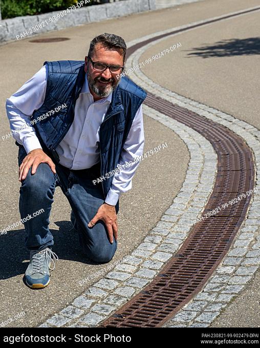 PRODUCTION - 11 August 2023, Bavaria, Neu-Ulm: Jochen Meissner, head of the city of Neu-Ulm's urban drainage and hydraulic engineering department