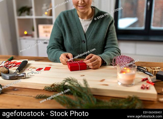 woman making advent calendar on christmas at home
