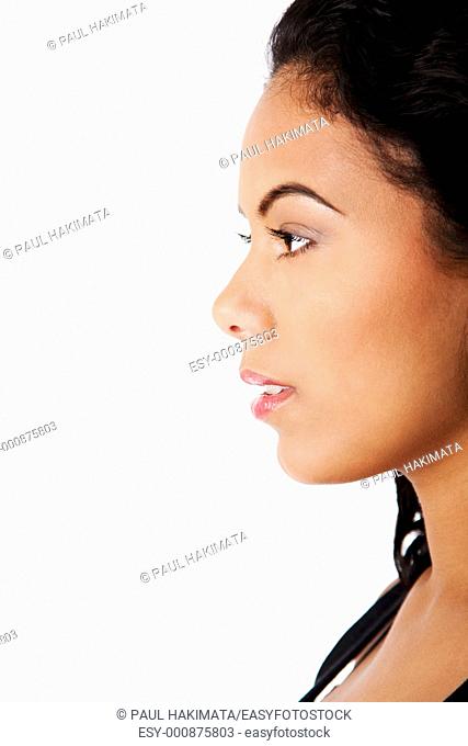 Side profile view of beautiful woman face with clear tanned skin and natural makeup, isolated