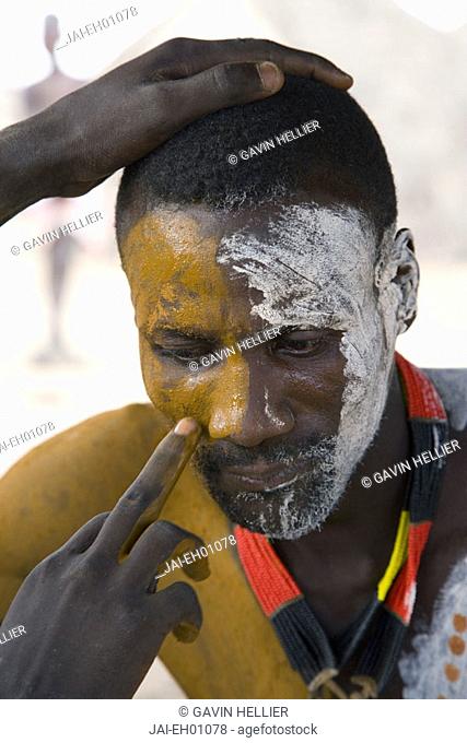 Karo Tribesman having his face painted, Lower Omo Valley, Ethiopia
