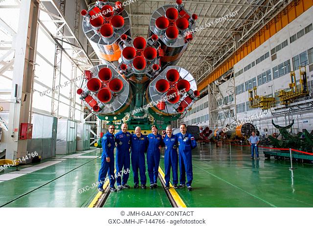 At the Baikonur Cosmodrome in Kazakhstan, the Expedition 53-54 prime and backup crewmembers pose for pictures Sept. 7 in front of the first stage engines of the...