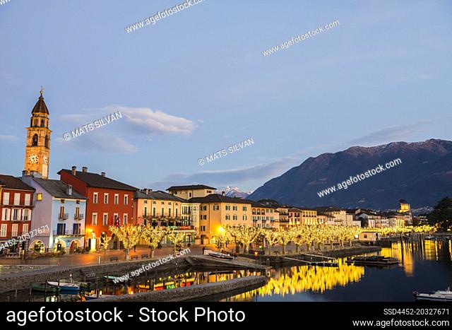 Illuminated City of Ascona and Alpine Lake Maggiore in Dusk in ticino, Switzerland