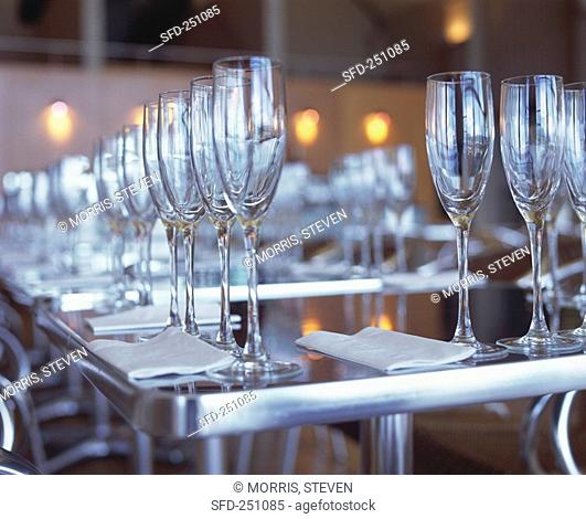 A Long Table Set with Many Champagne Flutes
