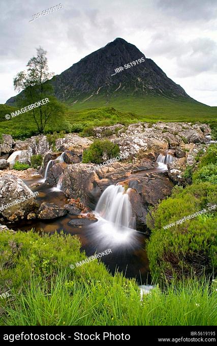 View of moorland with small waterfalls in rocky stream and mountain in background, Stob Dearg, Buachaille Etive Mor, Glen Etive, Highlands, Scotland