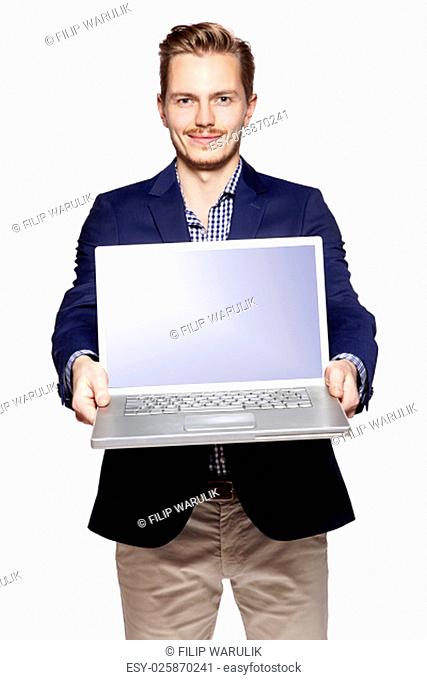 Photo of young businessman giving his laptop with copy space