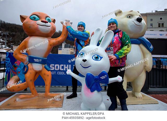 Volunteers pose between the Sochi 2014 Mascots Leopard, Hare and Polar Bear at Krasnaya Polyana next to the Rosa Khutor Alpine Resort near Sochi