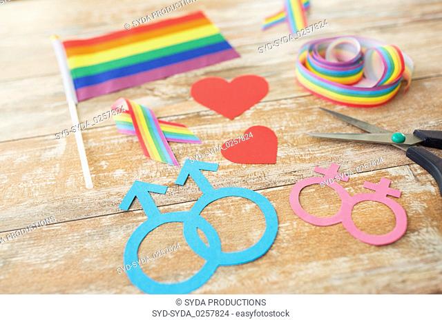 scissors and gay party props on wooden boards