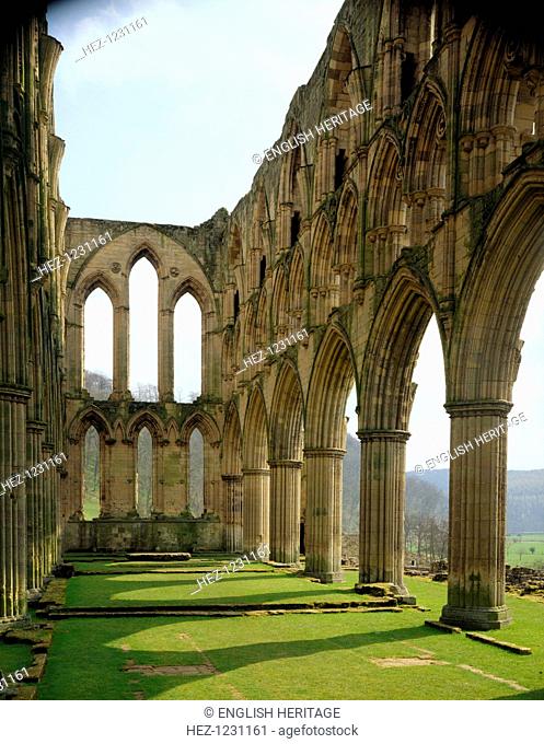 View eastwards along the chancel of the church at the Cistercian monastery of Rievaulx Abbey, North Yorkshire, 1994. The distant moors of the Yorkshire Wolds...