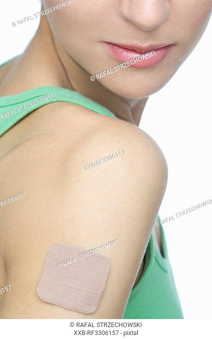 young woman with contraception patch