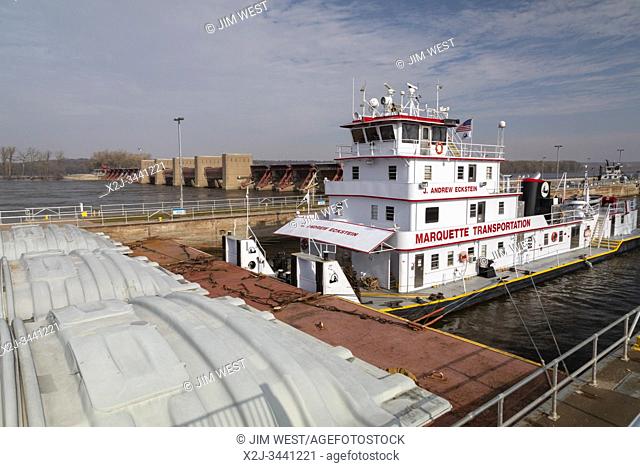 Illinois City, Illinois - A tugboat pushes barges containing corn and soybeans through Lock & Dam No. 16 on the upper Mississippi River