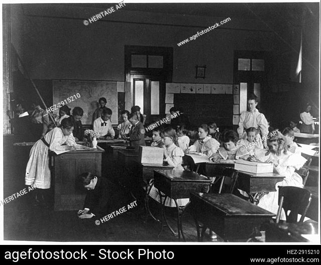 Rainy day activities in school - decorating the classroom, (1899?). Creator: Frances Benjamin Johnston