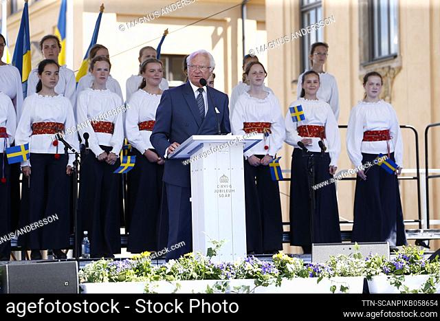 King Carl Gustaf holds his speech at the castle slope by the Royal Palace in Stockholm, Sweden, on June 22, 2023, during the royal visit to Stockholm County to...