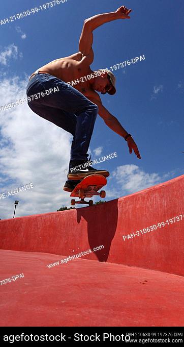 29 June 2021, Bavaria, Füssen: Max rides his skateboard on the extension of the pumptrack facility on the edge of the old town
