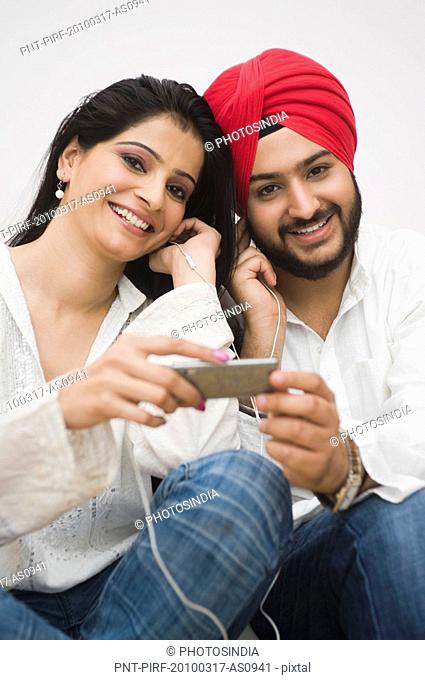 Sikh couple listening to music