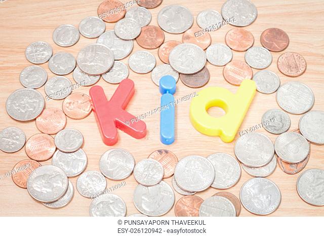 Kid alphabet with various US coins, stock photo