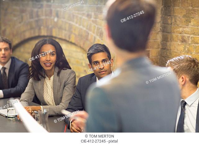 Businesswoman leading meeting in conference room