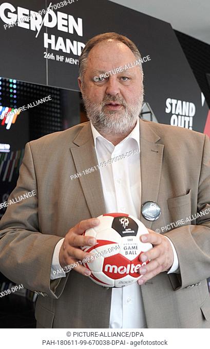 11 June 2018, Berlin, Germany: Andreas Michelmann, DHB President holds a ball during the presentation of Berlin's Handball world cup embassador
