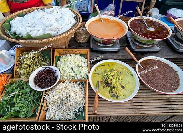 thai curry and Thai food at the market street at the Loy Krathong festival at the Historical Park in Sukhothai in the Provinz Sukhothai in Thailand