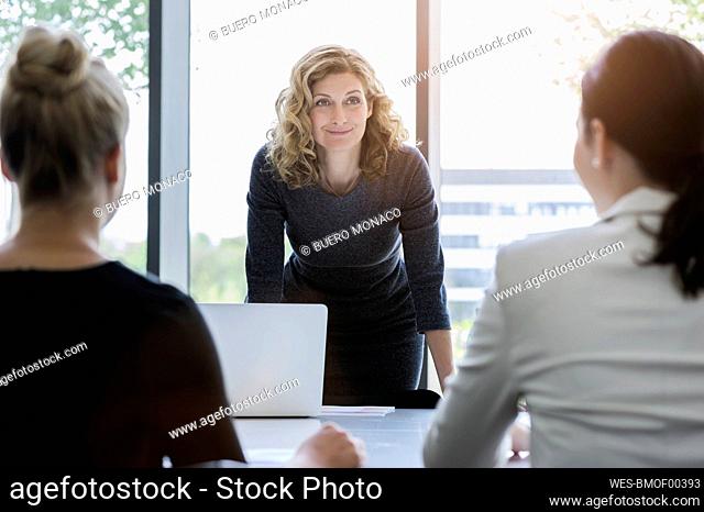 Businesswomen having a meeting in bright office