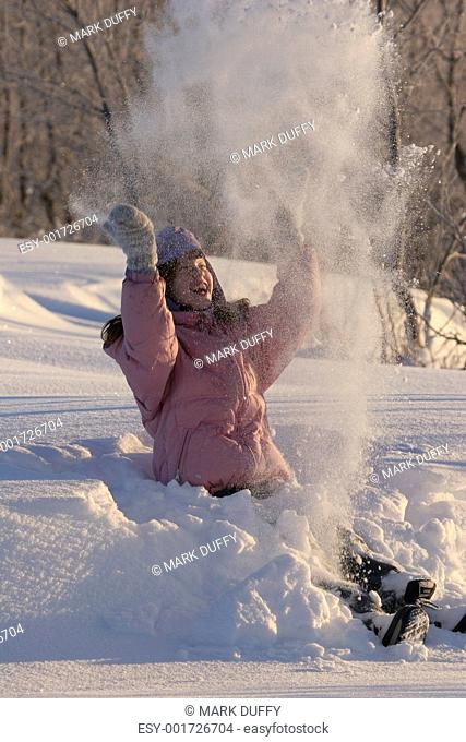 Girl throwing up snow