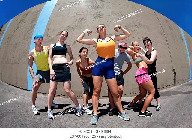 Woman posing with fitness friends