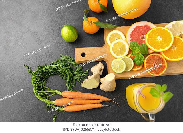 fruits, vegetables, cutting board and juice