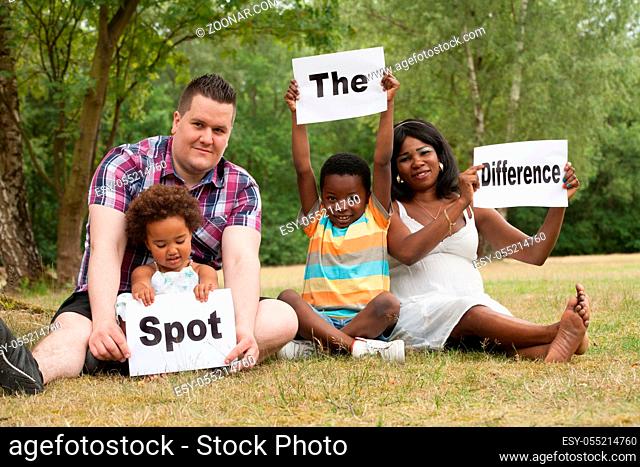 African multicultural family is holding white boards