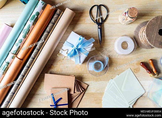 Wrapping paper with gifting material on desk