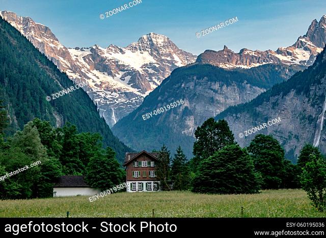 Isolated Rural House in a Meadow in Lauterbrunnen Valley with Waterfalls - Small Village - Jungfrau Region in Summer - Swiss Alps, Switzerland
