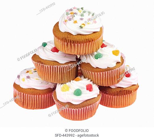 Various cupcakes decorated with sweets