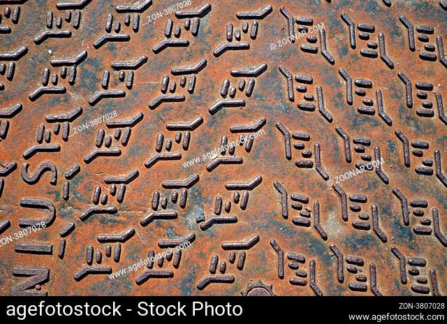 Background of rusty iron steel street well cover lid