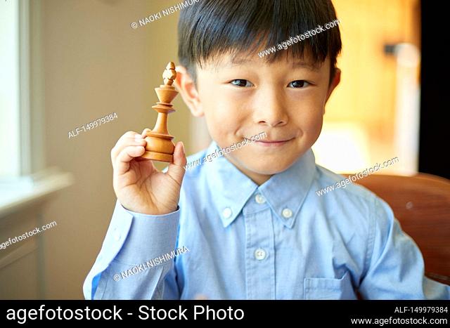 Japanese kid playing chess
